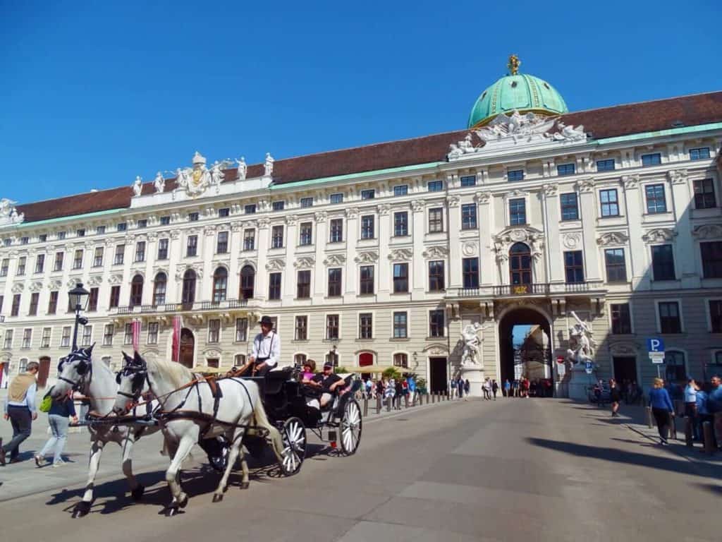 Hofburg Palace with horse and carriage Vienna