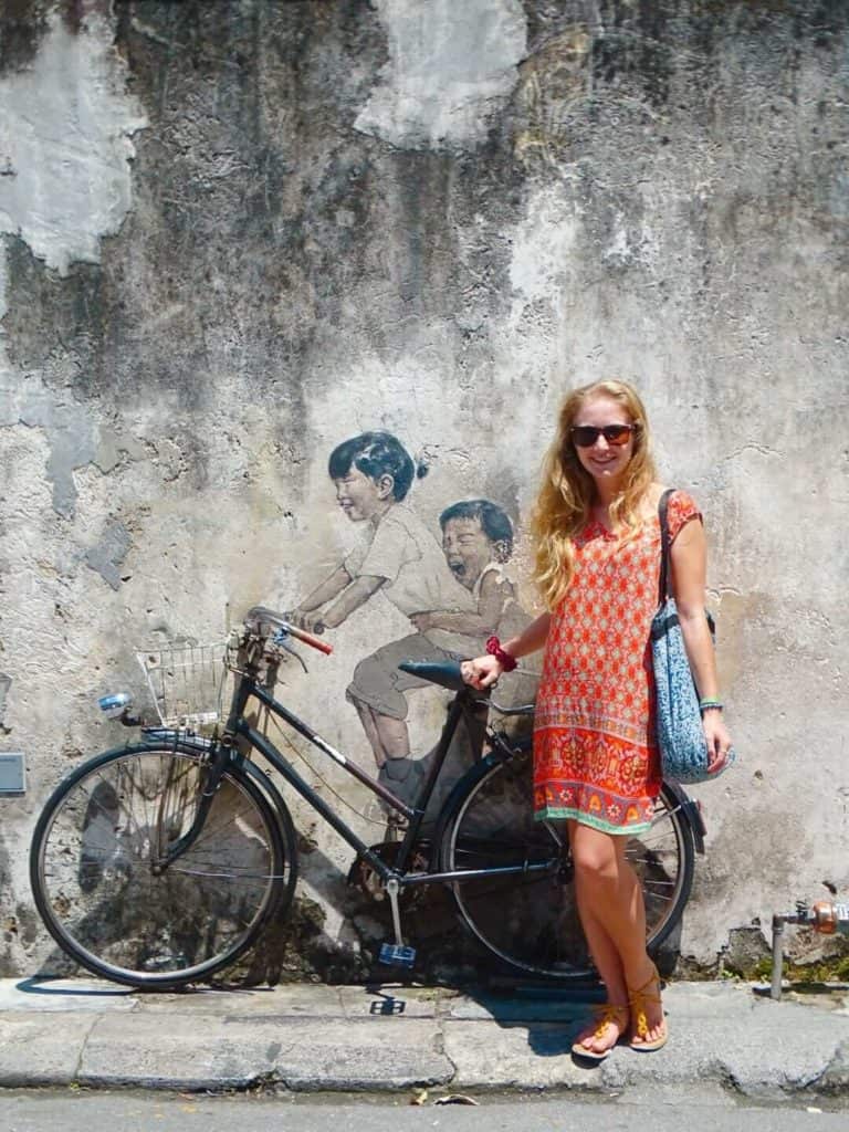 Children on a bike street art Penang