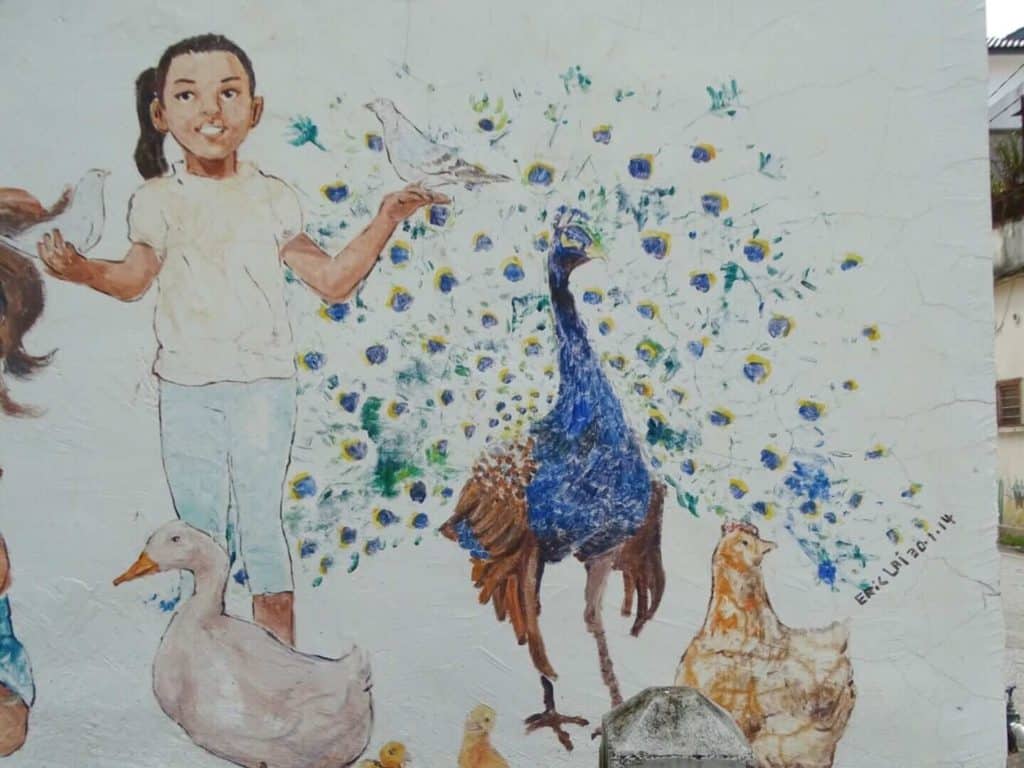 Ipoh mural of child and peacock