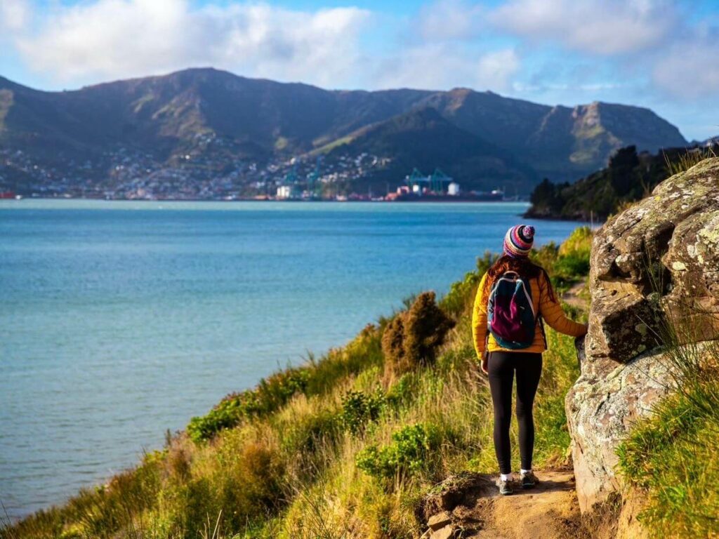 Woman traveller hiking around lake